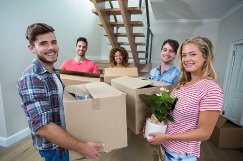 Moving vehicle loading commercial items near a Bow property