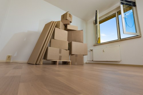 Furniture and boxes being loaded into a van for transport