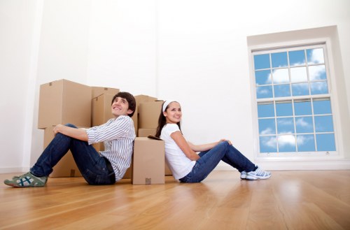 Professional movers handling a home removal in Bow with care