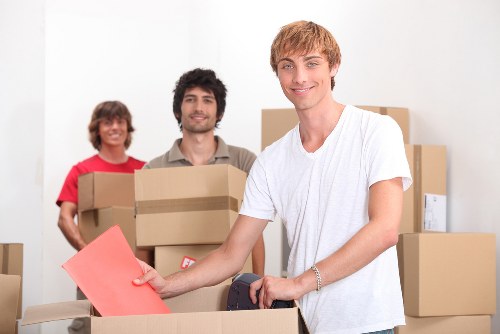 Packed moving boxes ready for collection in Bow