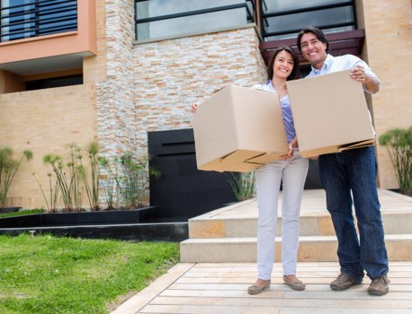 Local movers handling boxes and furniture near Bow properties