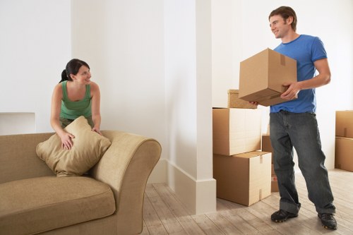 Movers handling IT equipment during an office move